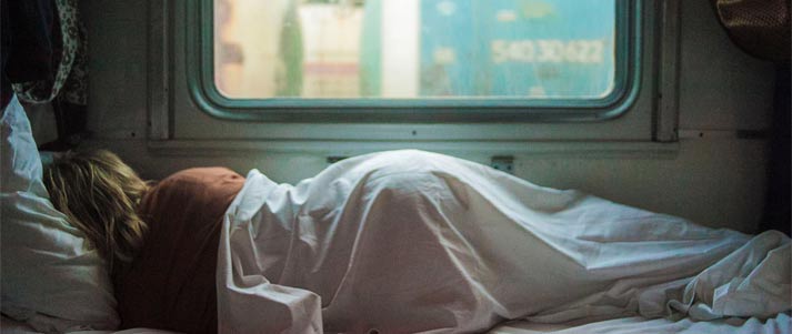 woman sleeping in a train