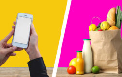 woman holding phone and bag of groceries
