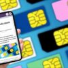 phone in hand in front of sim cards