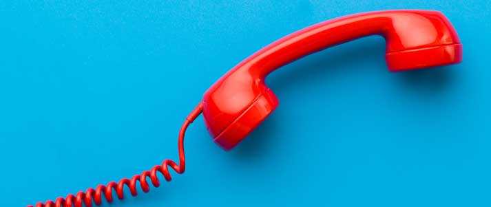 red phone with a blue background