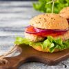 turkey burgers on wooden chopping board
