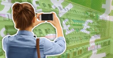 woman taking photo in shop